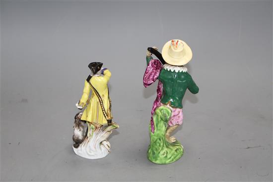 A 19th century Meissen figure of a huntsman and a 19th century English porcelain monkey band figure, 13.5cm and 16cm